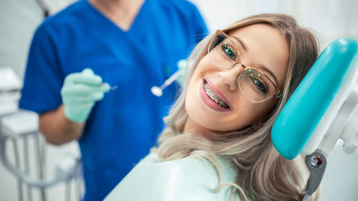 An adult having orthodontic treatment visiting an orthodontist