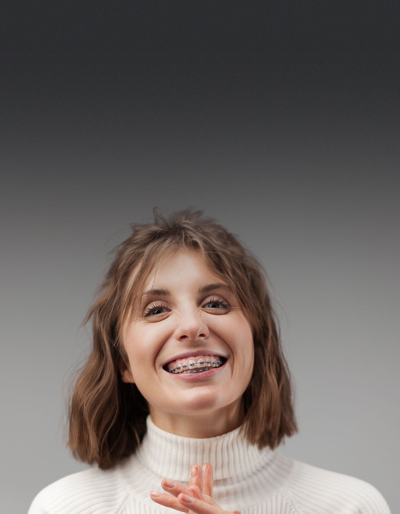 Orthodontic patient wearing a fixed orthodontic appliance